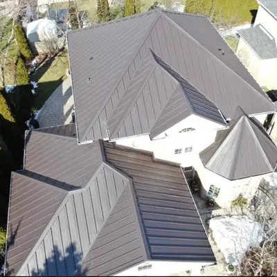 Standing seam roof dark brown on a large home, Greater Montreal