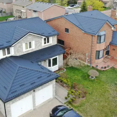 Metal tiles blue-grey on a brick house, Greater Montreal