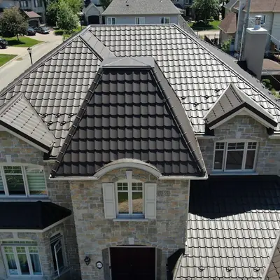 Metal tiles taupe brown, close up on a stone house, Greater Montreal